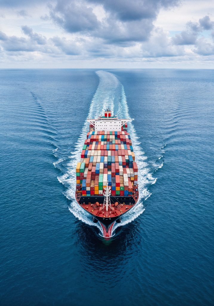 Cargo Ship Sailing Through Ocean 1 717x1024